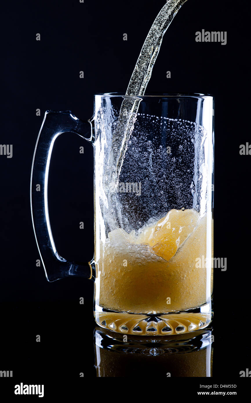 Bubbles in poured beer. Stock Photo
