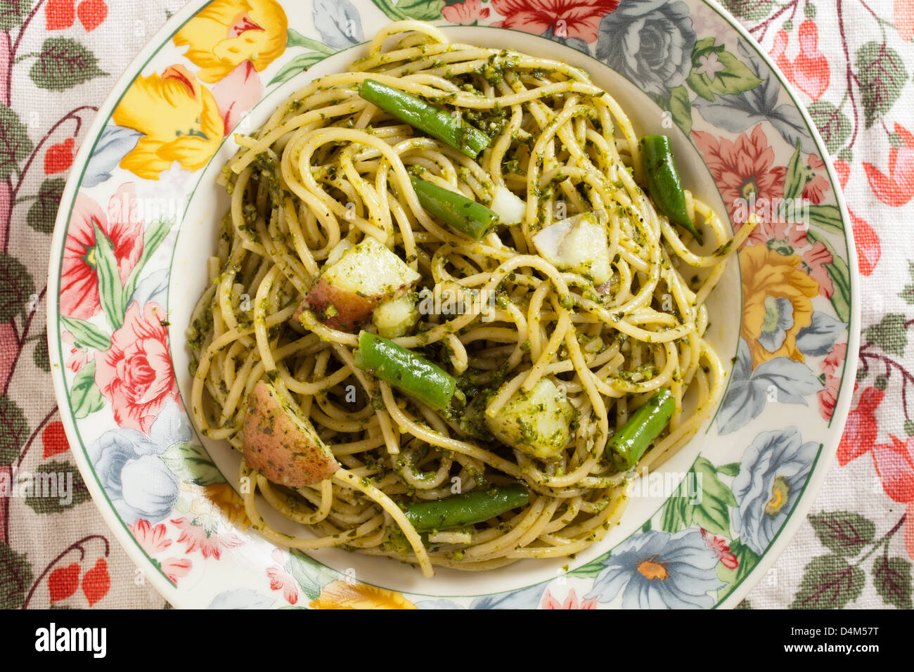 Spaghetti with Pesto Sauce served Italian style with green beans and potatoes Stock Photo