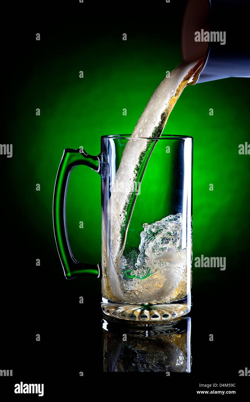 Motion of beer being poured. Stock Photo