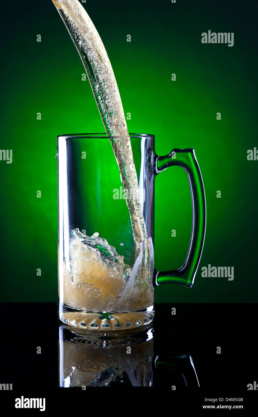 Motion of beer being poured. Stock Photo