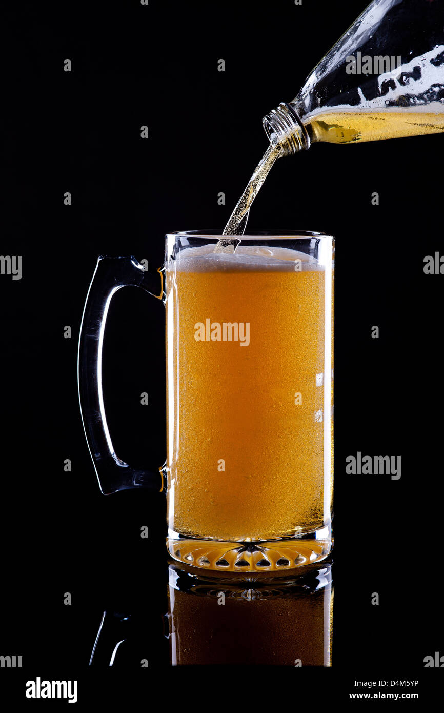 Pouring beer. Stock Photo