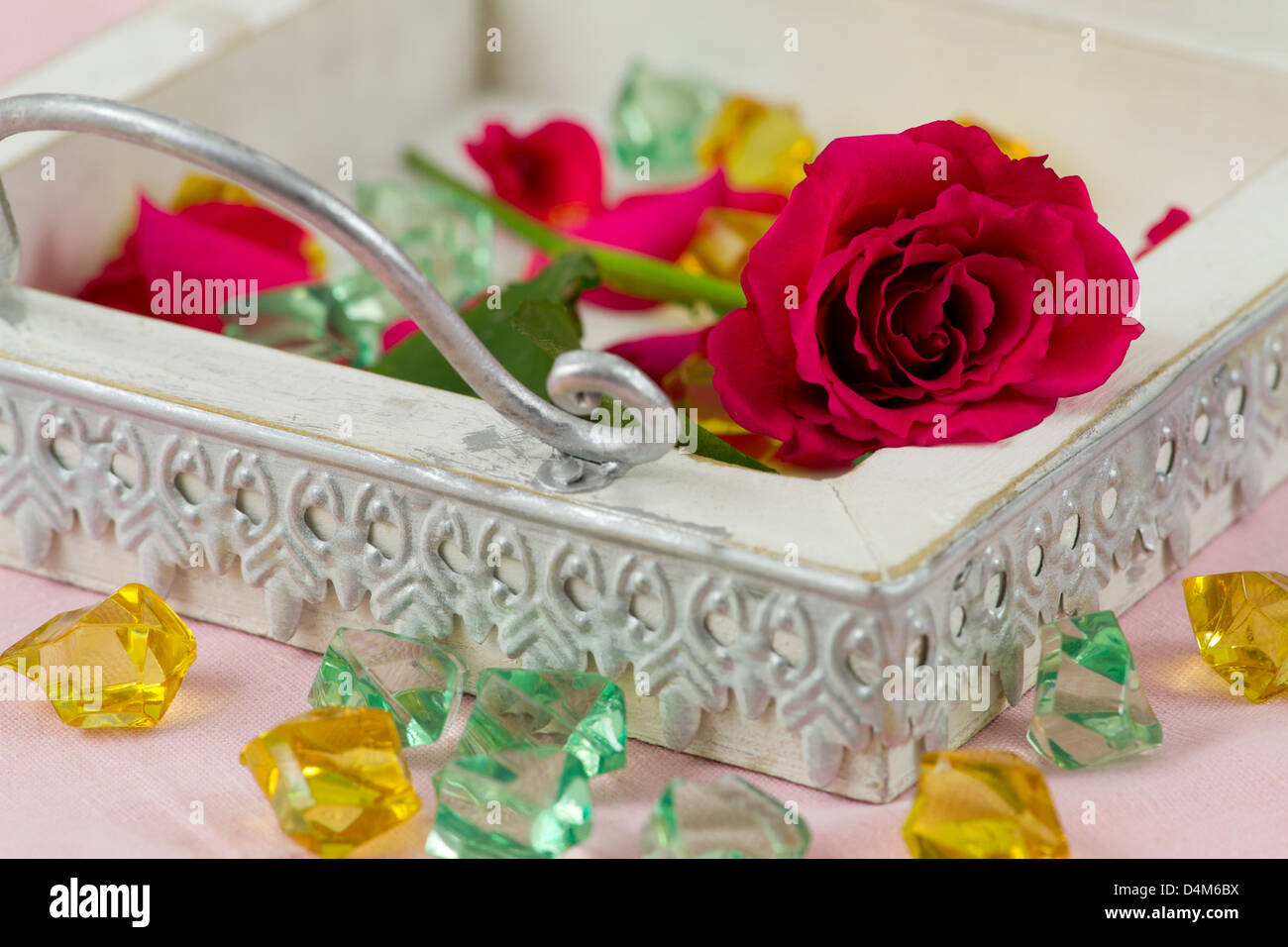 vintage tray with red rose, rose petals and crystals Stock Photo