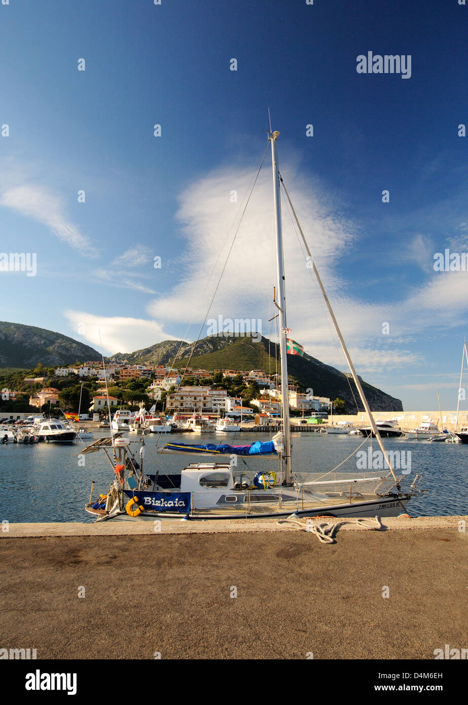 Yacht at safe moor on the small port of Cala Gonone, in the