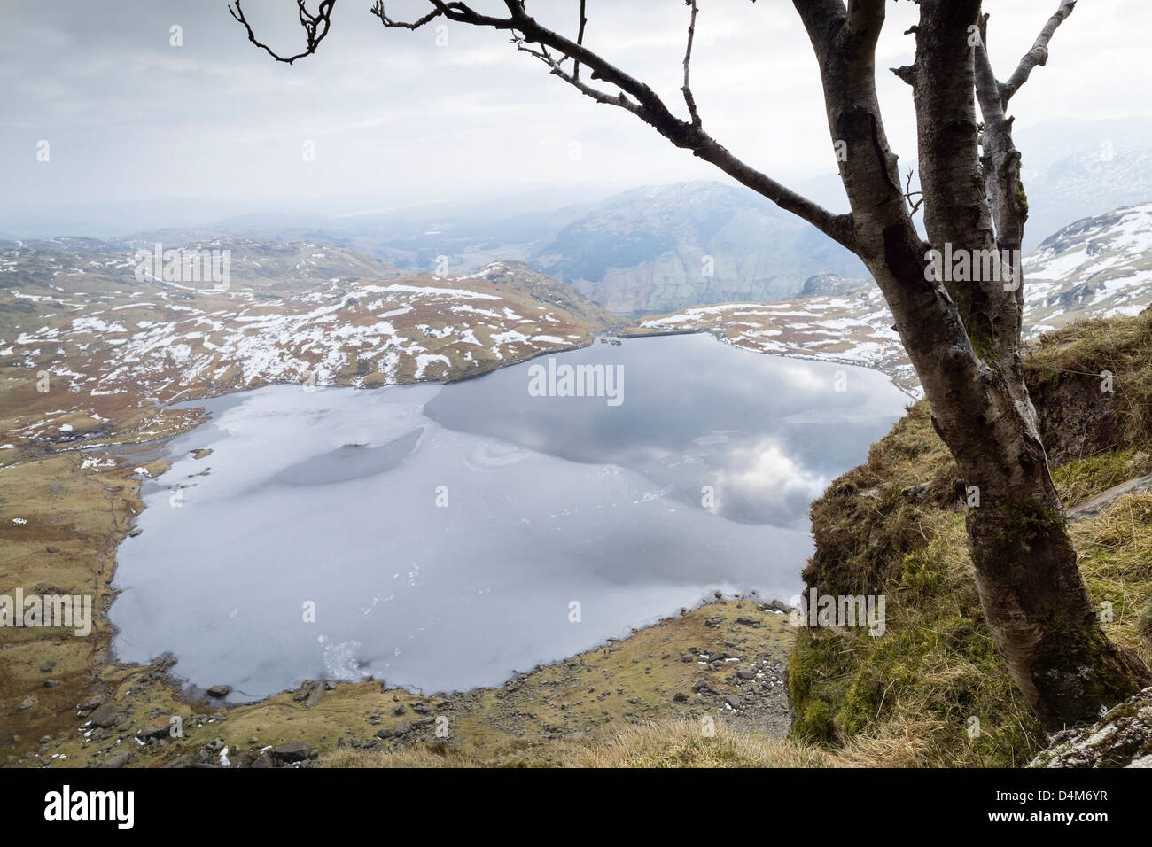 Looking out across Stickle Tarn from half way up Jack's Rake on Pavey Ark in the Lake District. Stock Photo