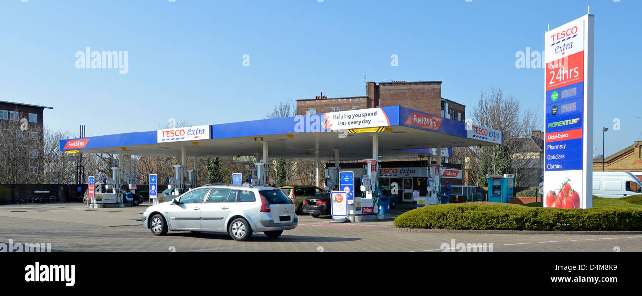 Cars at petrol filling station forecourt at Tesco Extra supermarket Stock Photo