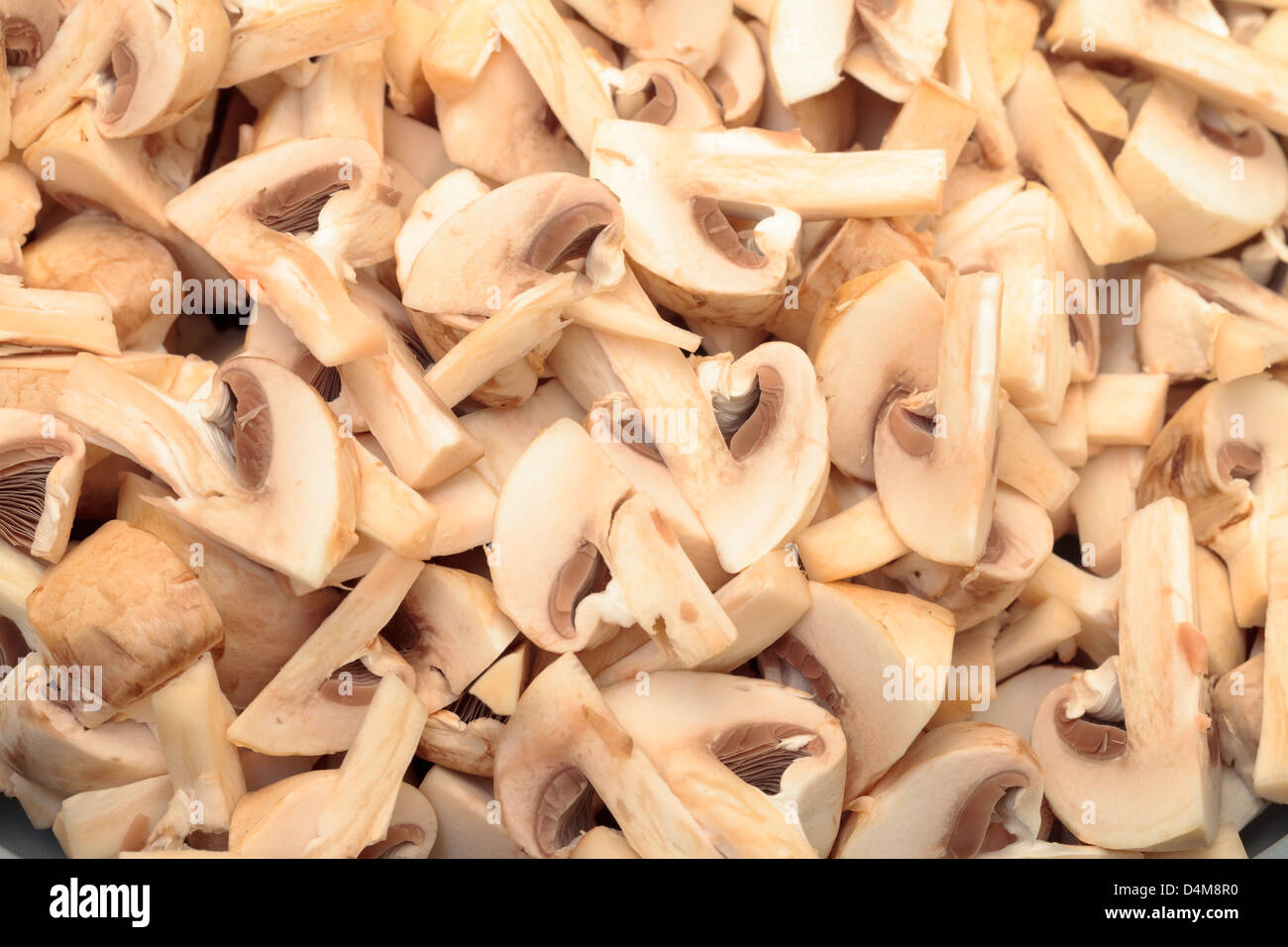 Fresh sliced Mushrooms Champignons closeup backdrop Stock Photo