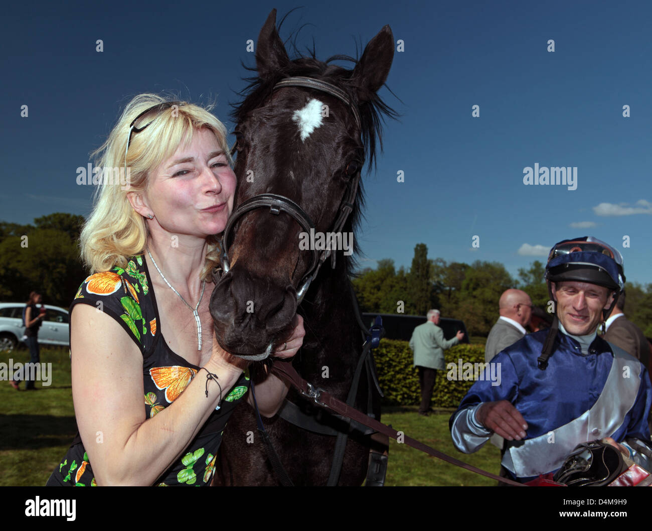 Leipzig, Germany, happy owner of cuddles after the victory with her horse Stock Photo