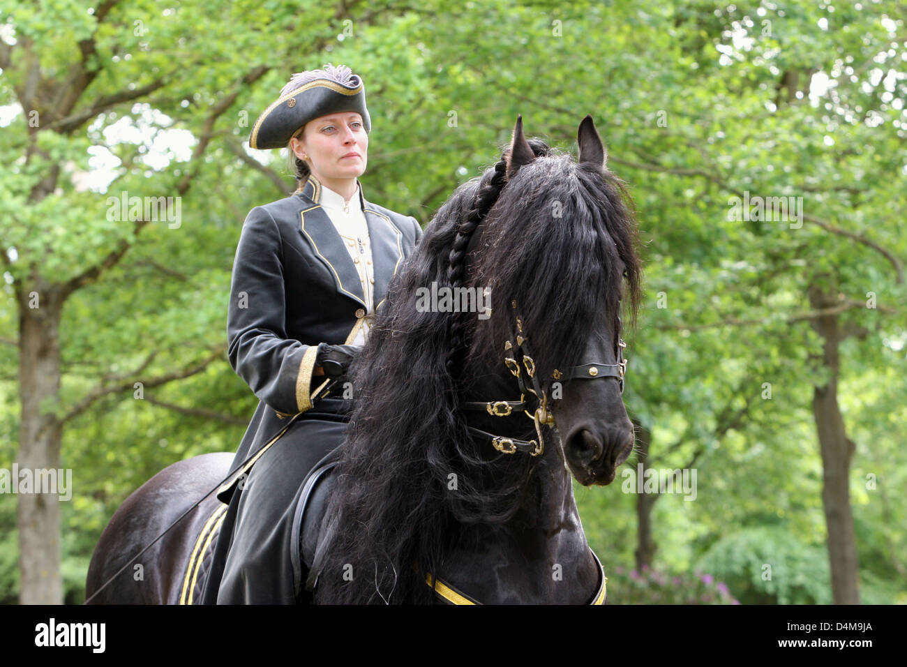 Hannover, Germany, one rider in Baroque clothing Friesen Stock Photo
