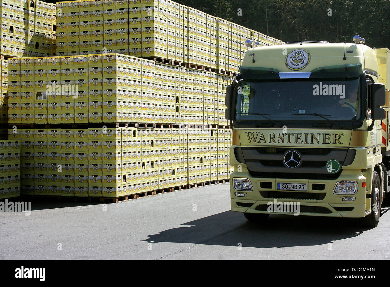 Warstein, Germany, trucks and beer cases on the grounds of the brewery Warsteiner Stock Photo