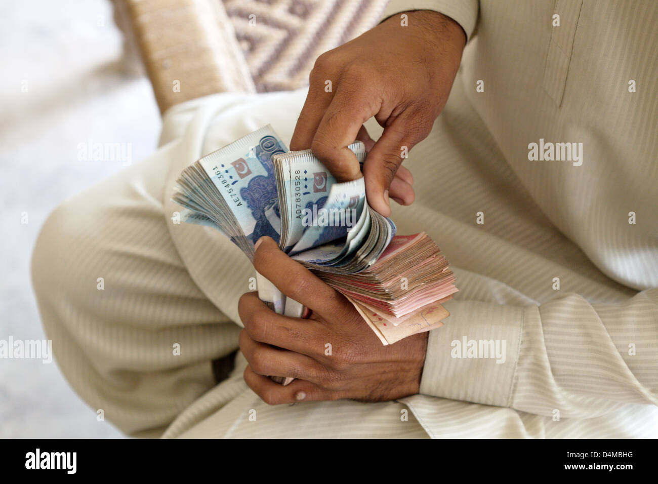 Hamzomahar, Pakistan, payday for workers Stock Photo