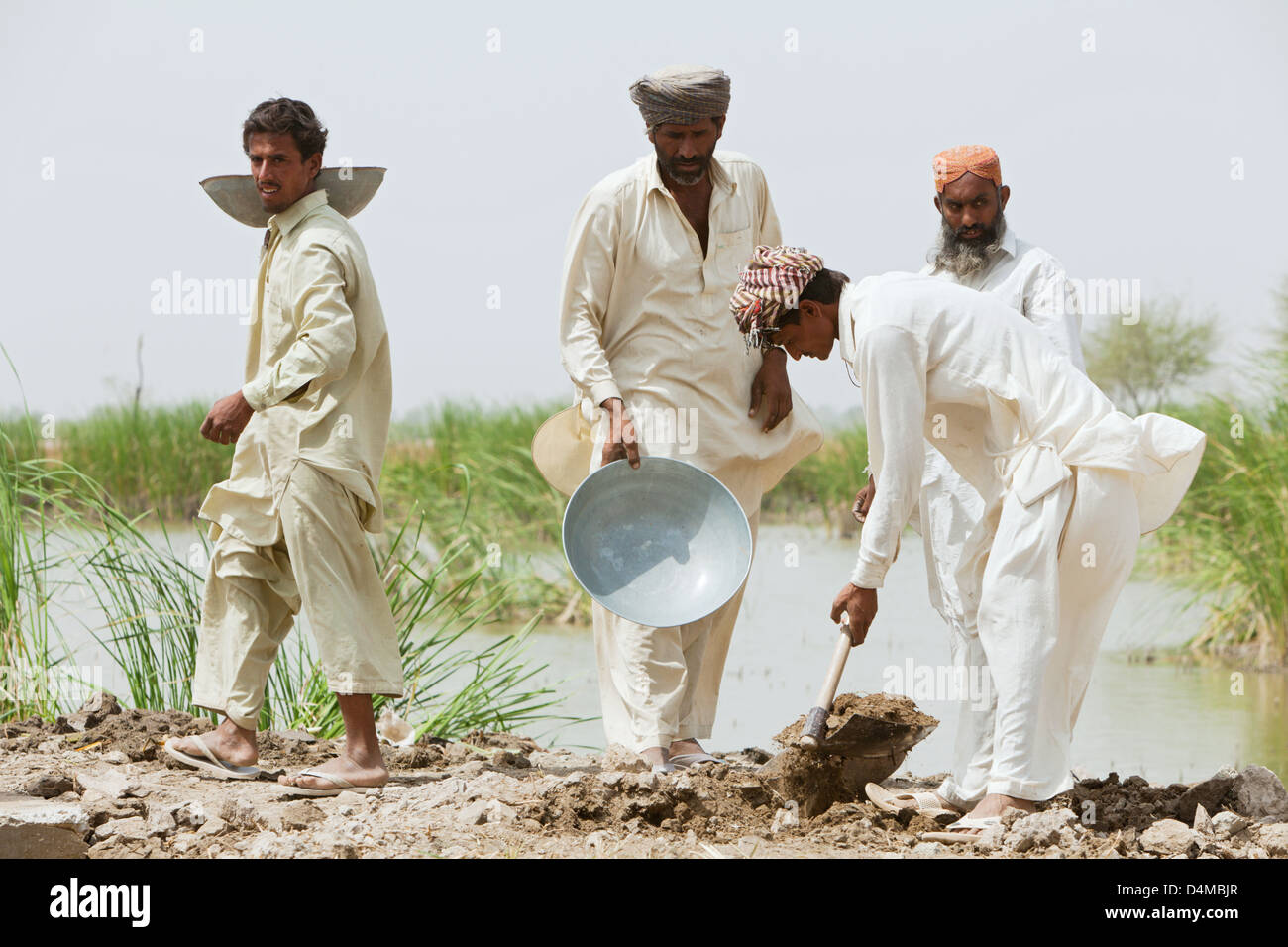 Hamzomahar, Pakistan, cleaning a sewer Stock Photo