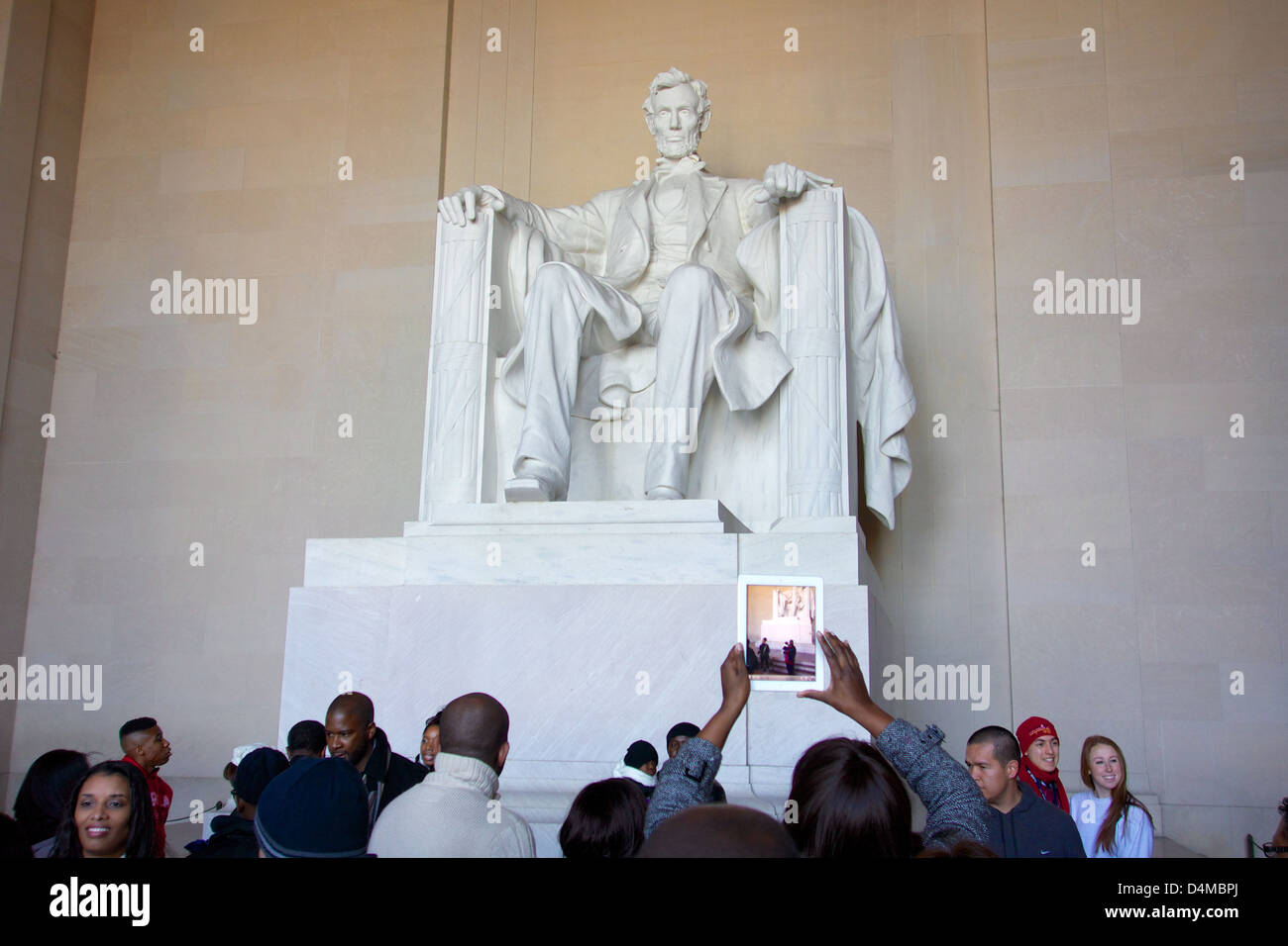 Lincoln Memorial with pre-inauguration crowd. Washington DC. Woman taking photo with iPad. Stock Photo