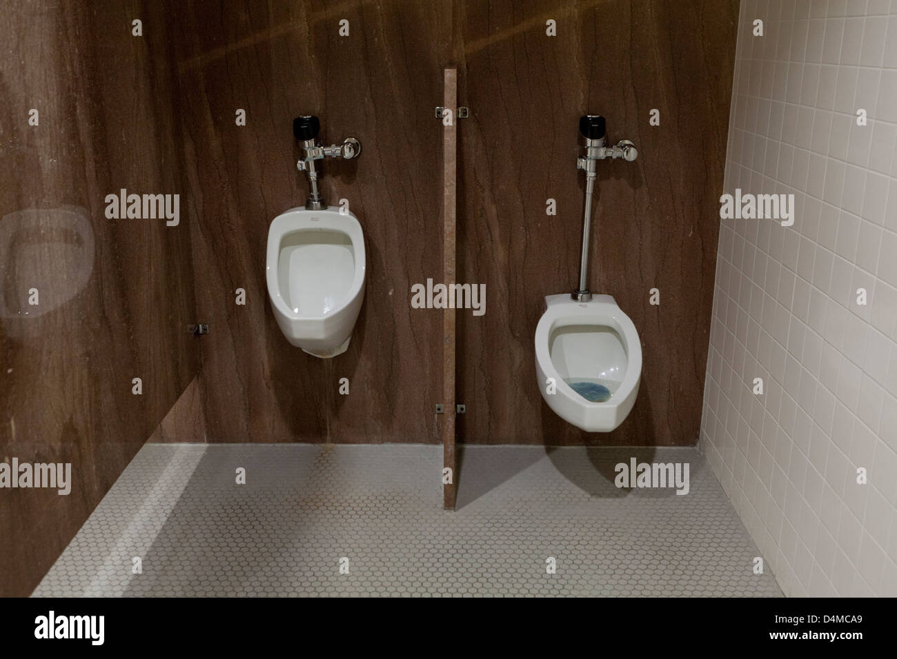 Mens room urinals Stock Photo