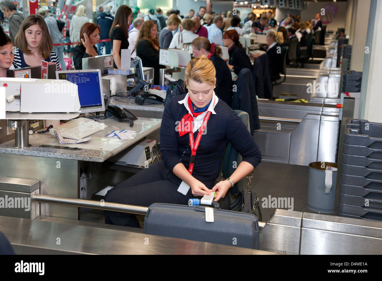 Duesseldorf, Germany, ground staff at airberlin check-in desk at the airport Duesseldorf International Stock Photo