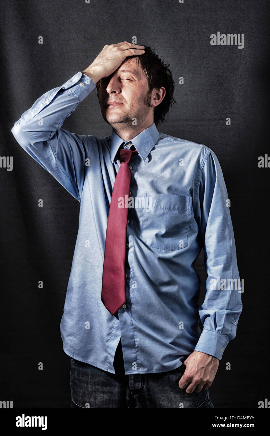 Businessman with the stress in low key technique Stock Photo