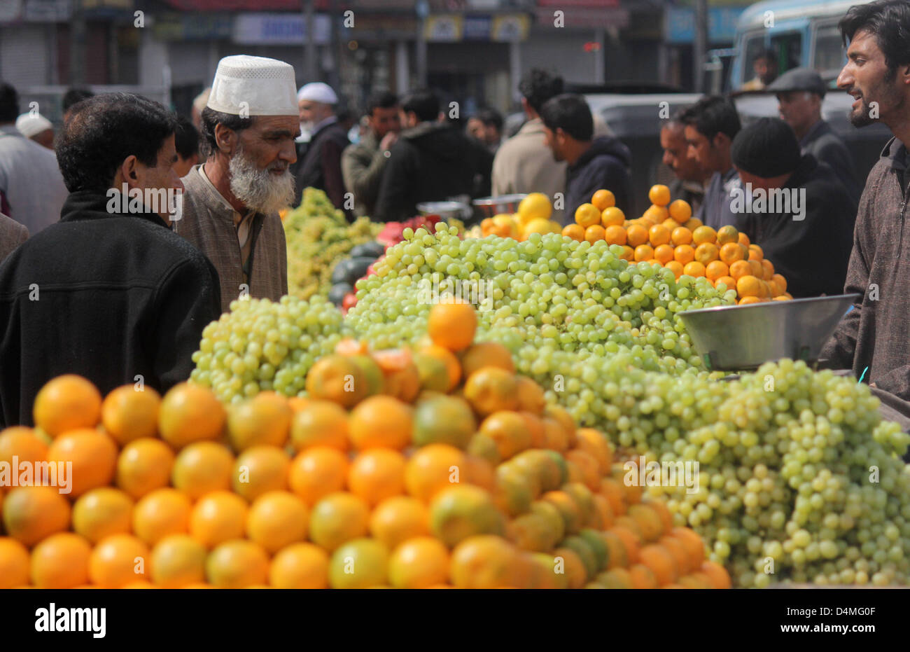 March 16, 2013 - A kasmiri muslim  Buying  fruits at a market  after the  Releaxation of curfew in srinagar, the summer capital of indian kashmir , on 16/3/2013,Curfew was imposed on Thursday after a 34-year-old youth was killed when Indian paramilitary soldiers  allegedly opened fire after coming under attack by a group of stone pelters in the Zoonimar area..Photo/Altaf Zargar/Zuam Press (Credit Image: © Altaf Zargar/ZUMAPRESS.com) Stock Photo