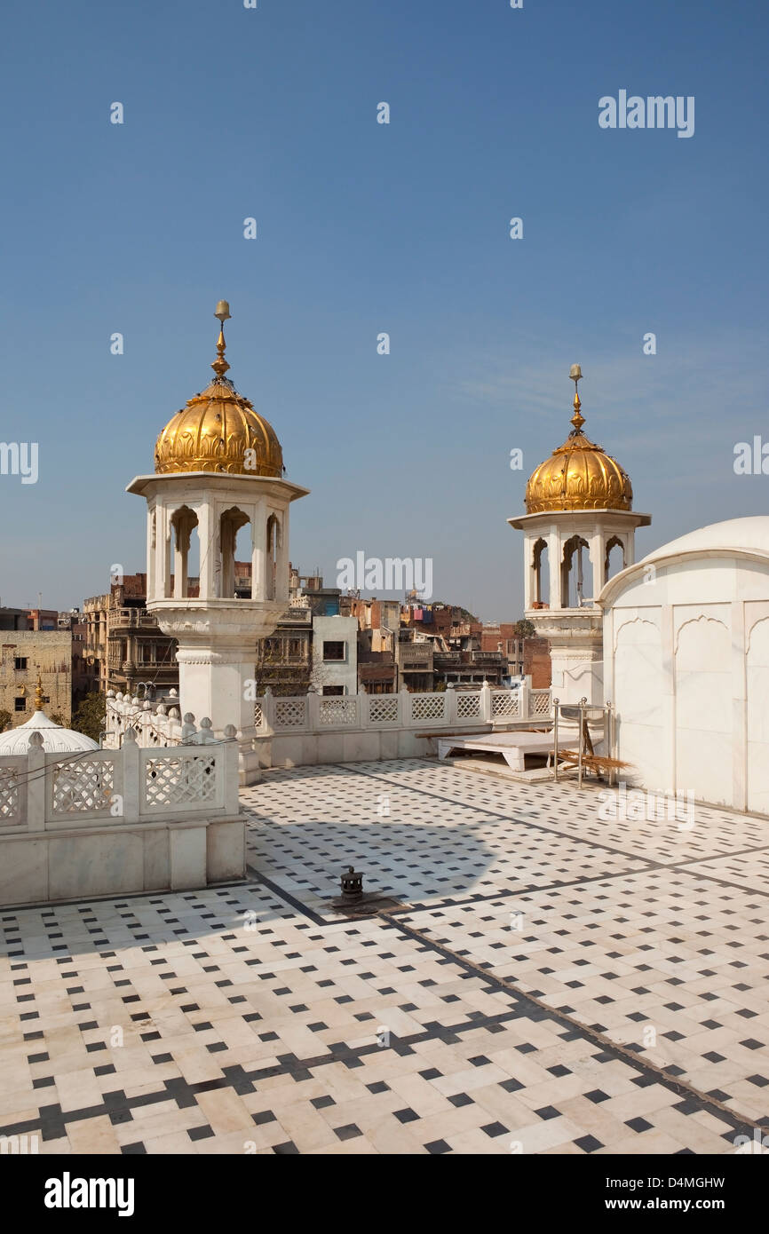 Decorative architecture with ornamental minarets and marble flooring at the Golden Temple Amritsar Punjab India Stock Photo