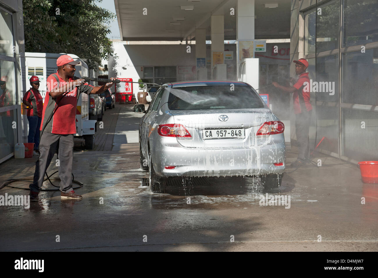 Hand car wash business washing and drying a vehicle Stock Photo Alamy