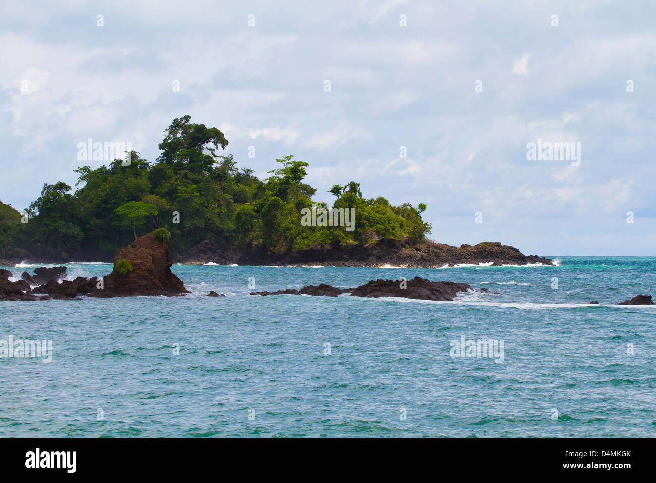 Peninsula with cliffs, tropical trees and lush vegetation Stock Photo