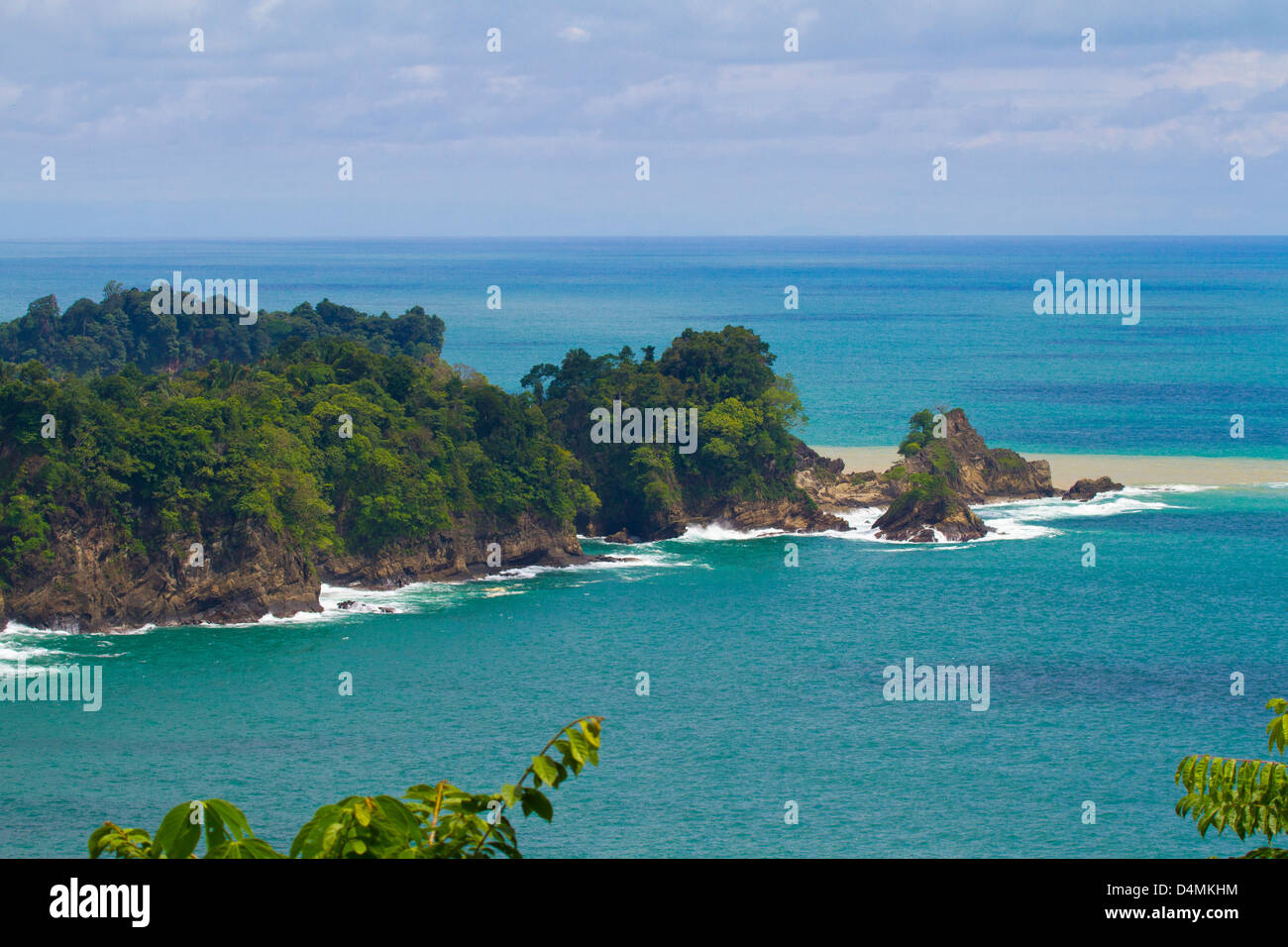 Peninsula with cliffs, tropical trees and lush vegetation Stock Photo