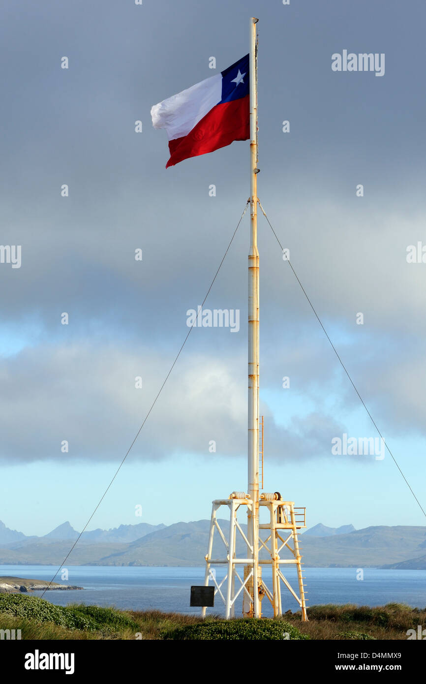 The national flag of Chile, La Estrella Solitaria, (The Lone Star) flies over the Cape Horn National Park. Cabo de Hornos. Stock Photo