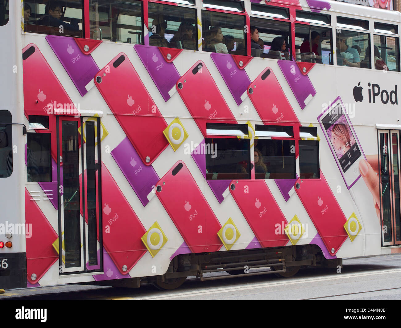 Apple advertisement of the iPod on the side of a Hong Kong tram travelling through Wan Chai Stock Photo