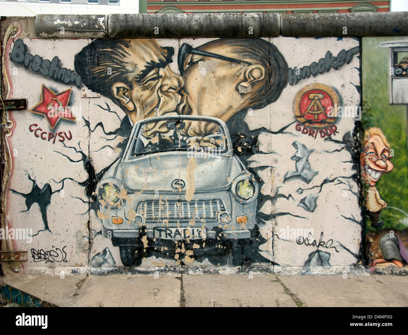 kiss from the Berlin Wall containing now new designs with a trabant car