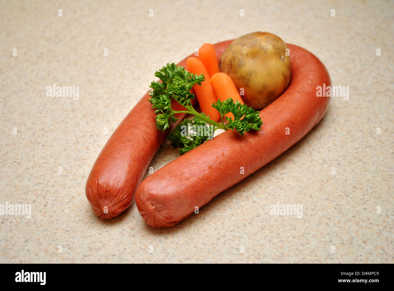 Raw Vegetables with Whole Kielbasa Stock Photo
