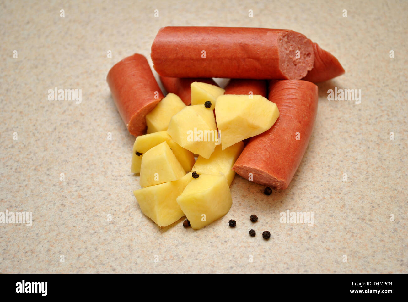 Raw Kielbasa with Potatoes and Peppercorns Stock Photo