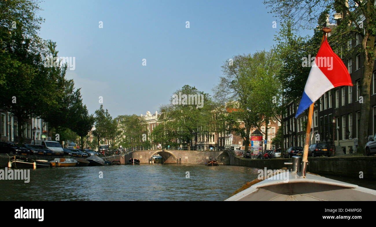 The Netherlands Holland Amsterdam Herengracht Canal District Golden Age Dutch Flag Red White Blue Boat Bridge Stock Photo