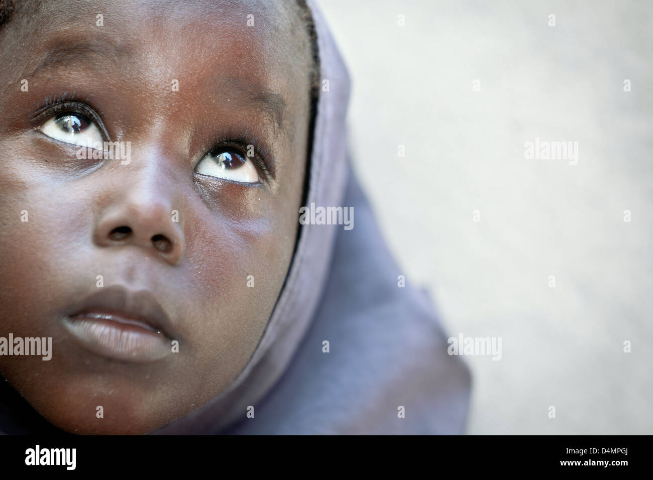 A young Somali girl  in a hijab inside the UN-run hospital at the main AMISOM military base at Aden Ade International Airport. Stock Photo