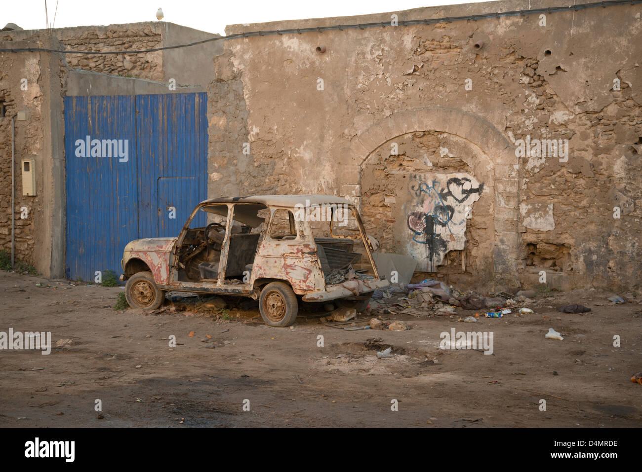 Renault 4 car abandoned on a dusty street in Morocco Stock Photo