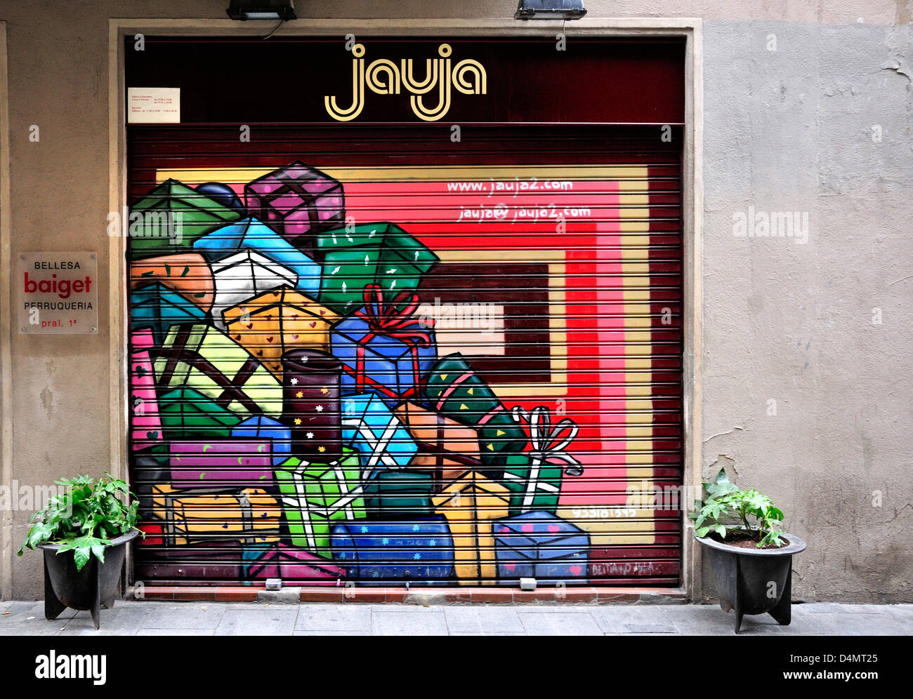 Barcelona, Catalonia, Spain. Painted shop shutters reflecting the business. Jauja gift shop in Carrer de Santa Anna Stock Photo