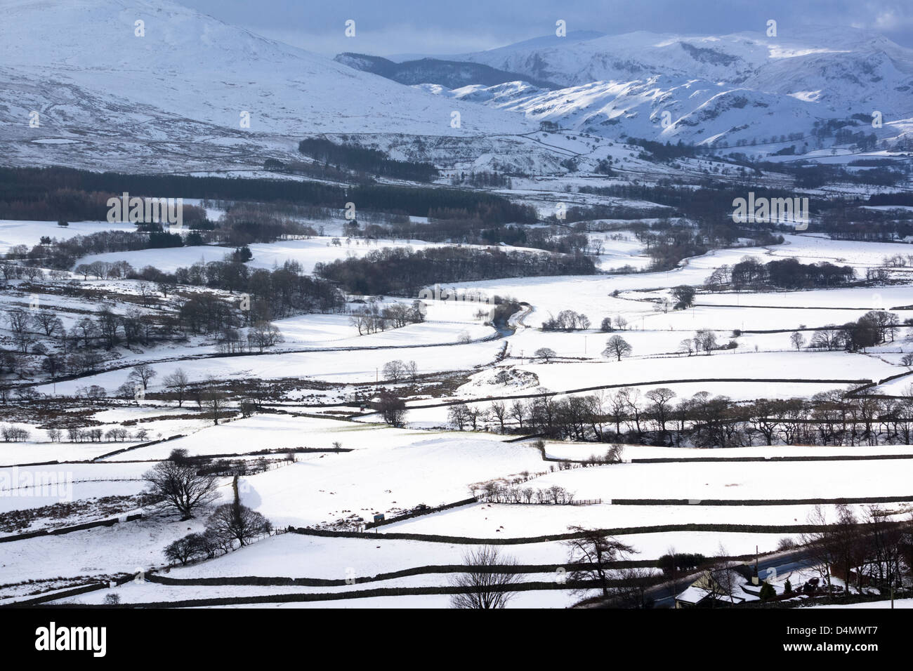 Looking over Threlkeld towards the mountains in the Lake District in winter from Blencathra. Stock Photo