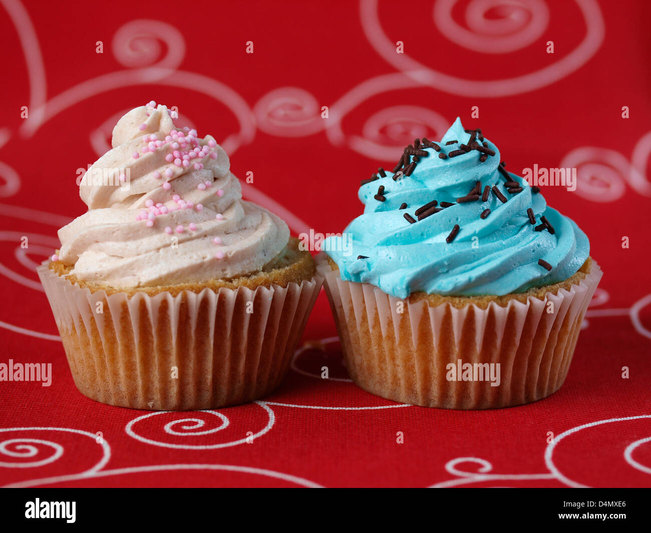 Two cupcakes of diferent colors Stock Photo Alamy
