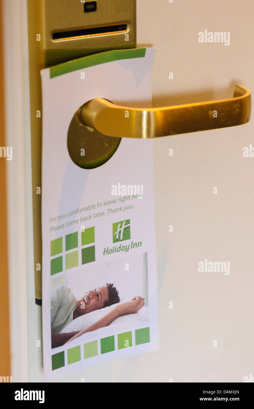 Do Not Disturb sign hanging on the handle of a Holiday Inn hotel room door Stock Photo