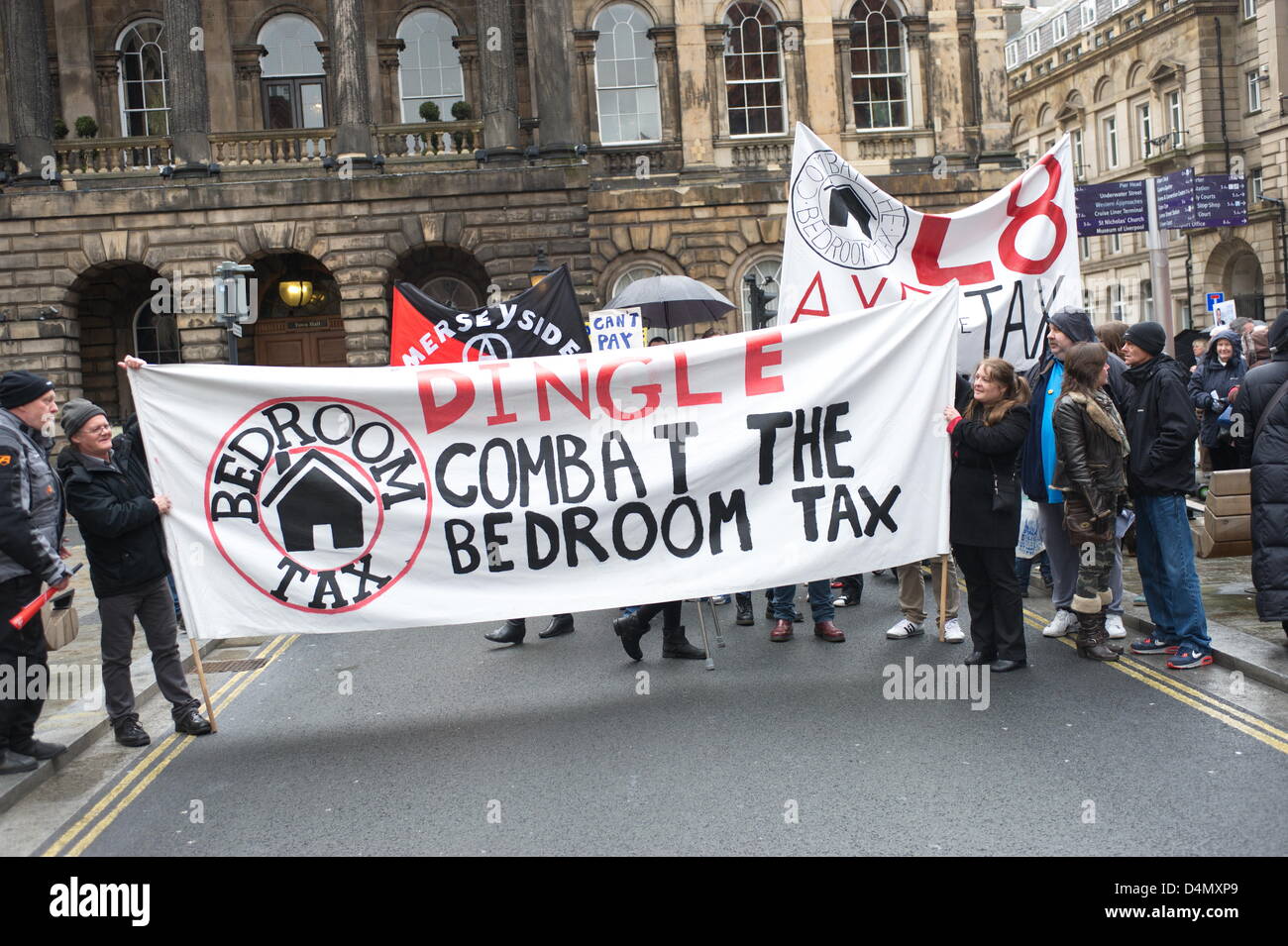 Liverpool, UK. Saturday 16th March 2013. Banners and signs as the Combat the Bedroom Tax group prepares to march to the demonstration. As part of nationwide protests, campaigners gathered in Liverpool city centre to demonstrate against a new 'bedroom tax' that will cut benefits to people with a spare room. Credit: David Colbran/Alamy Live News Stock Photo