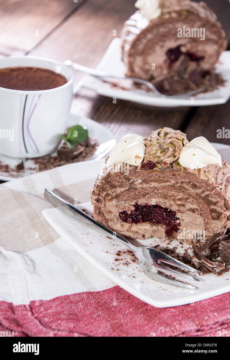 Portion of Chocolate Cake on wooden background Stock Photo