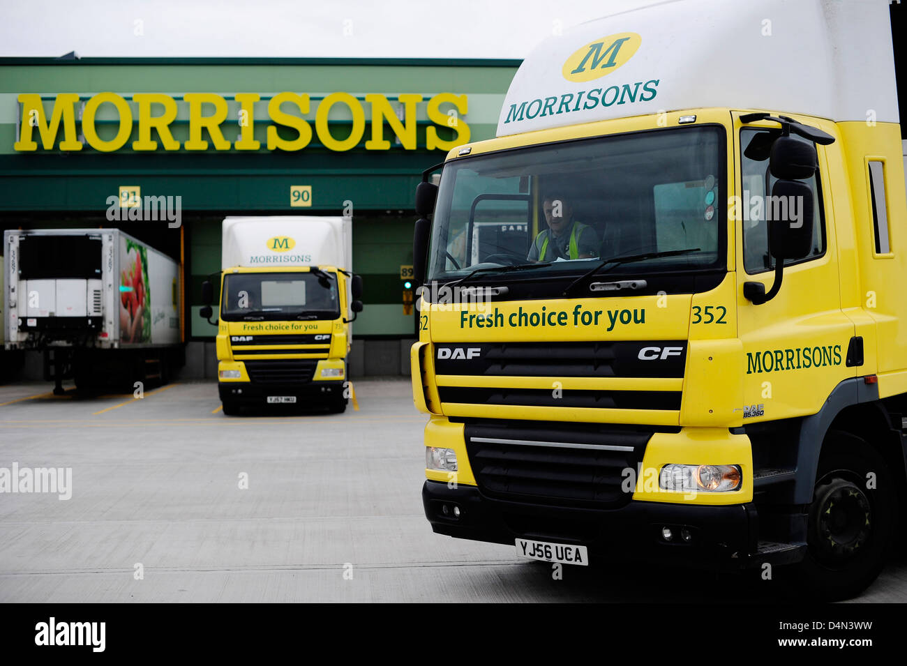 Morrisons supermarket store, with delivery trucks Stock Photo Alamy