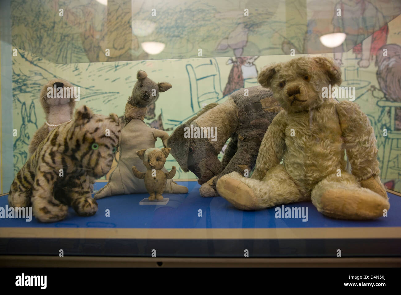 The original Winne the Pooh stuffed toy animals in a glass display case in New York Public Library Stock Photo