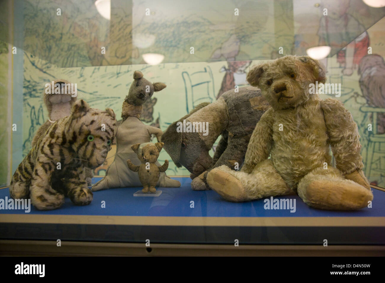 The original Winne the Pooh stuffed toy animals in a glass display case in New York Public Library Stock Photo
