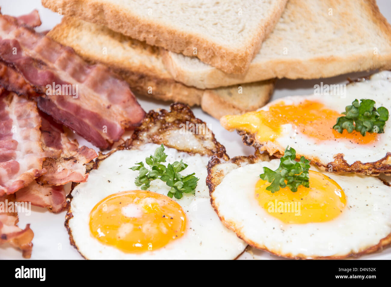 Fried Eggs and Bacon on a plate Stock Photo - Alamy
