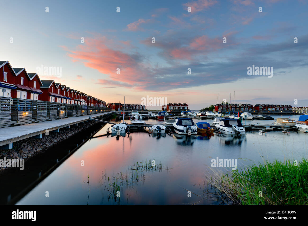 Sunset over sea cottages and waterfront, Mellerud, Sweden, Europe Stock Photo