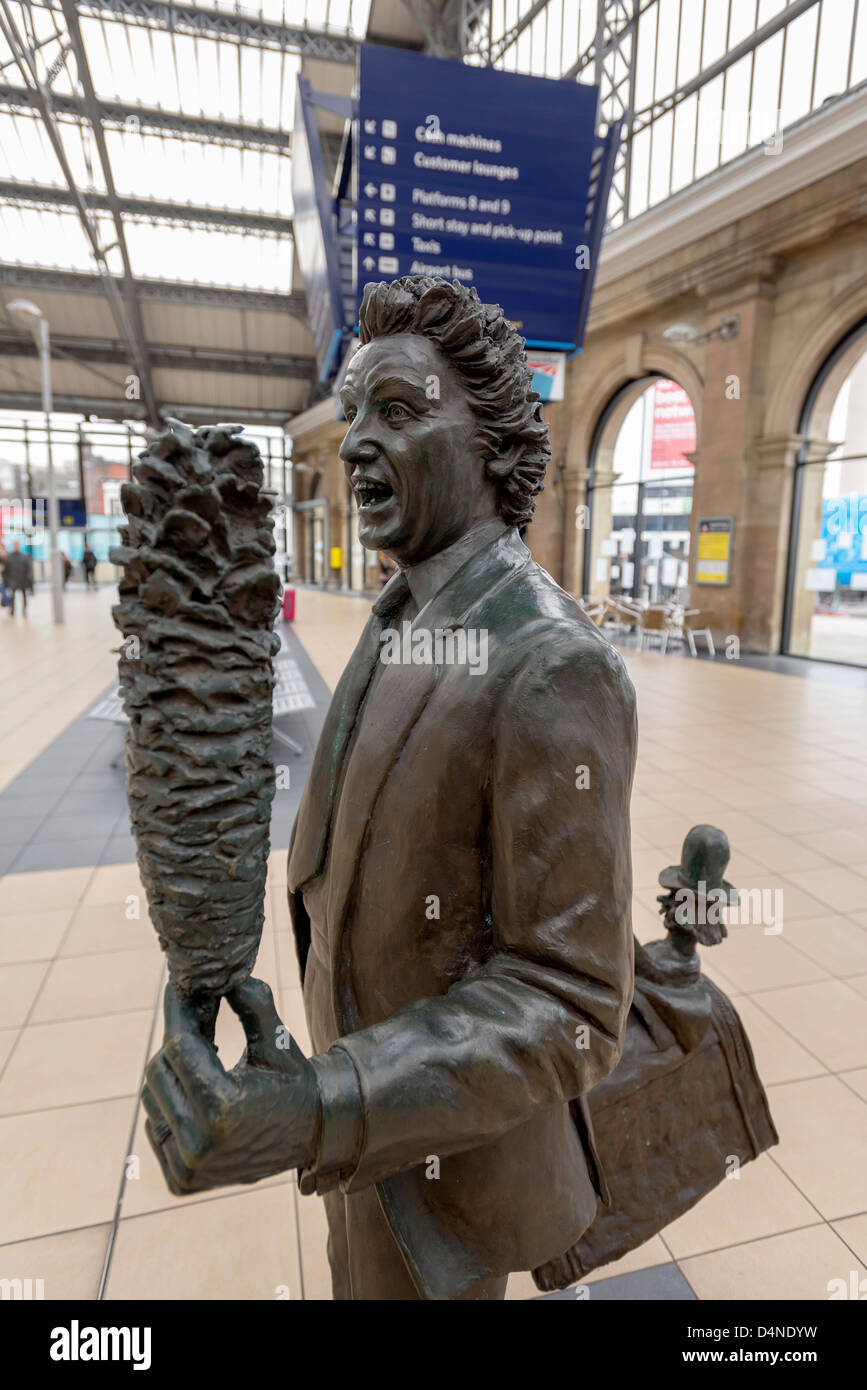 Statue of Ken Dodd comedian and entertainer at Lime street station