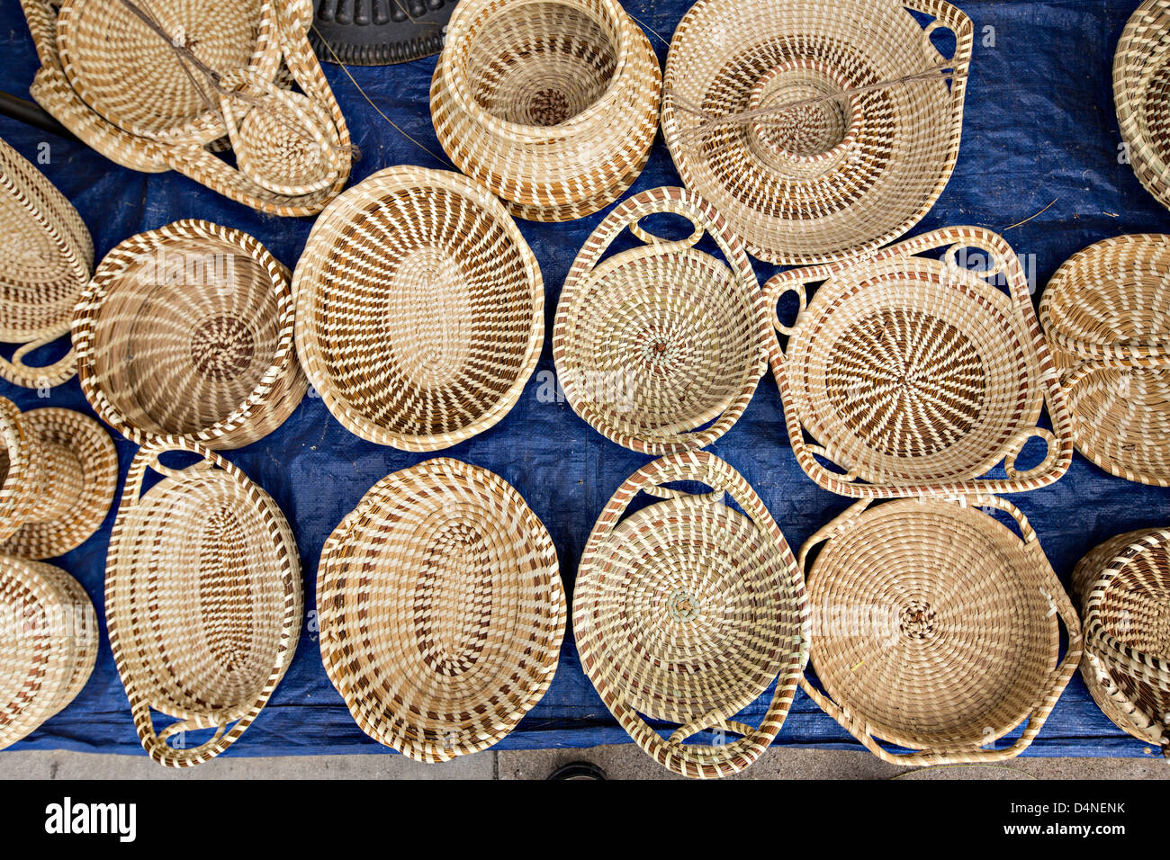 Gullah woman weaving sweetgrass baskets at the Historic Charleston City
