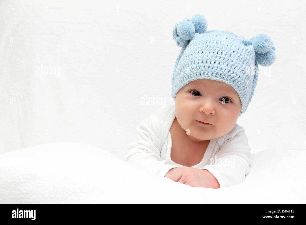 baby in blue knitted hat Stock Photo