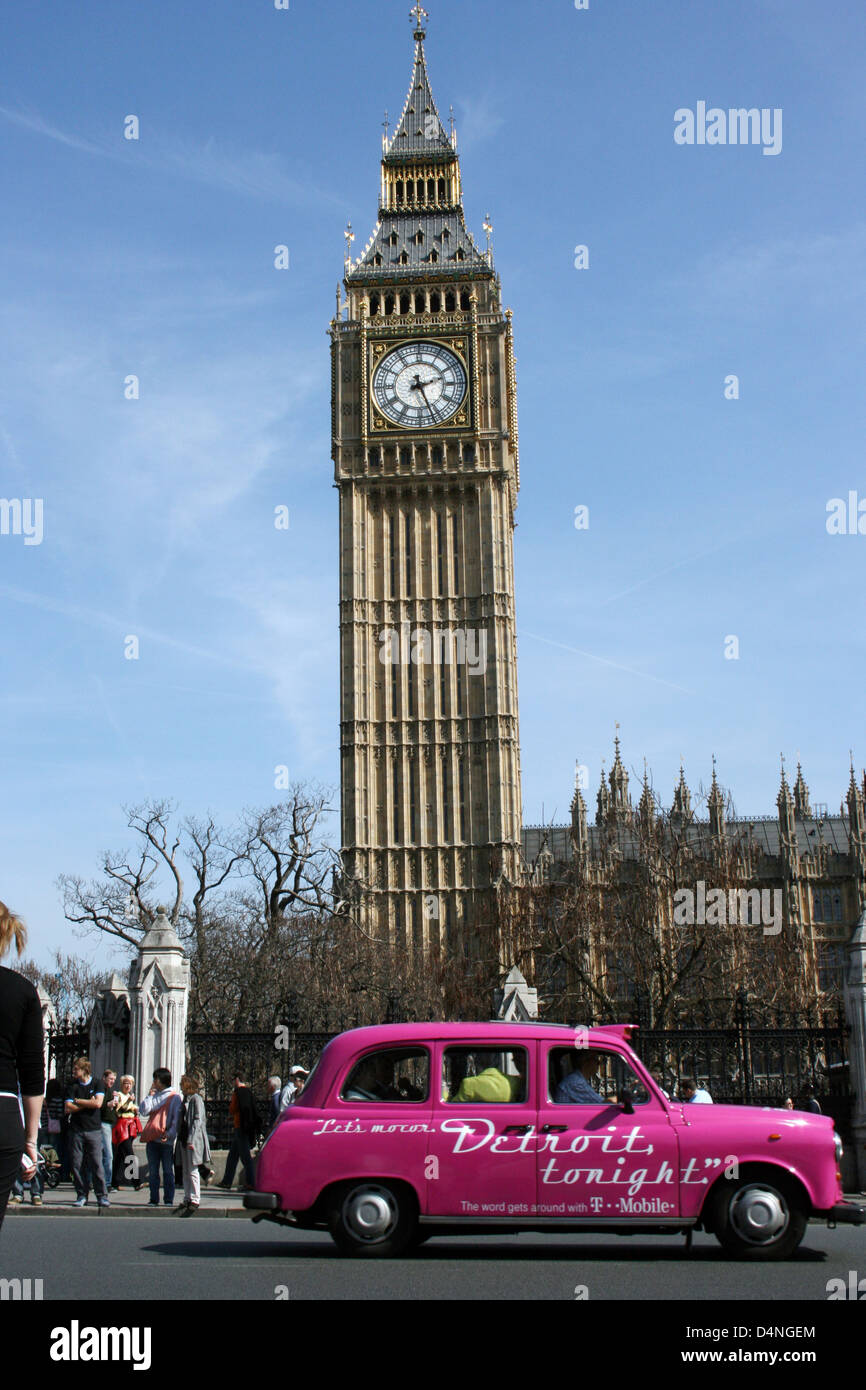 London taxi drives by Big Ben, House of Parliament, London, England Stock Photo