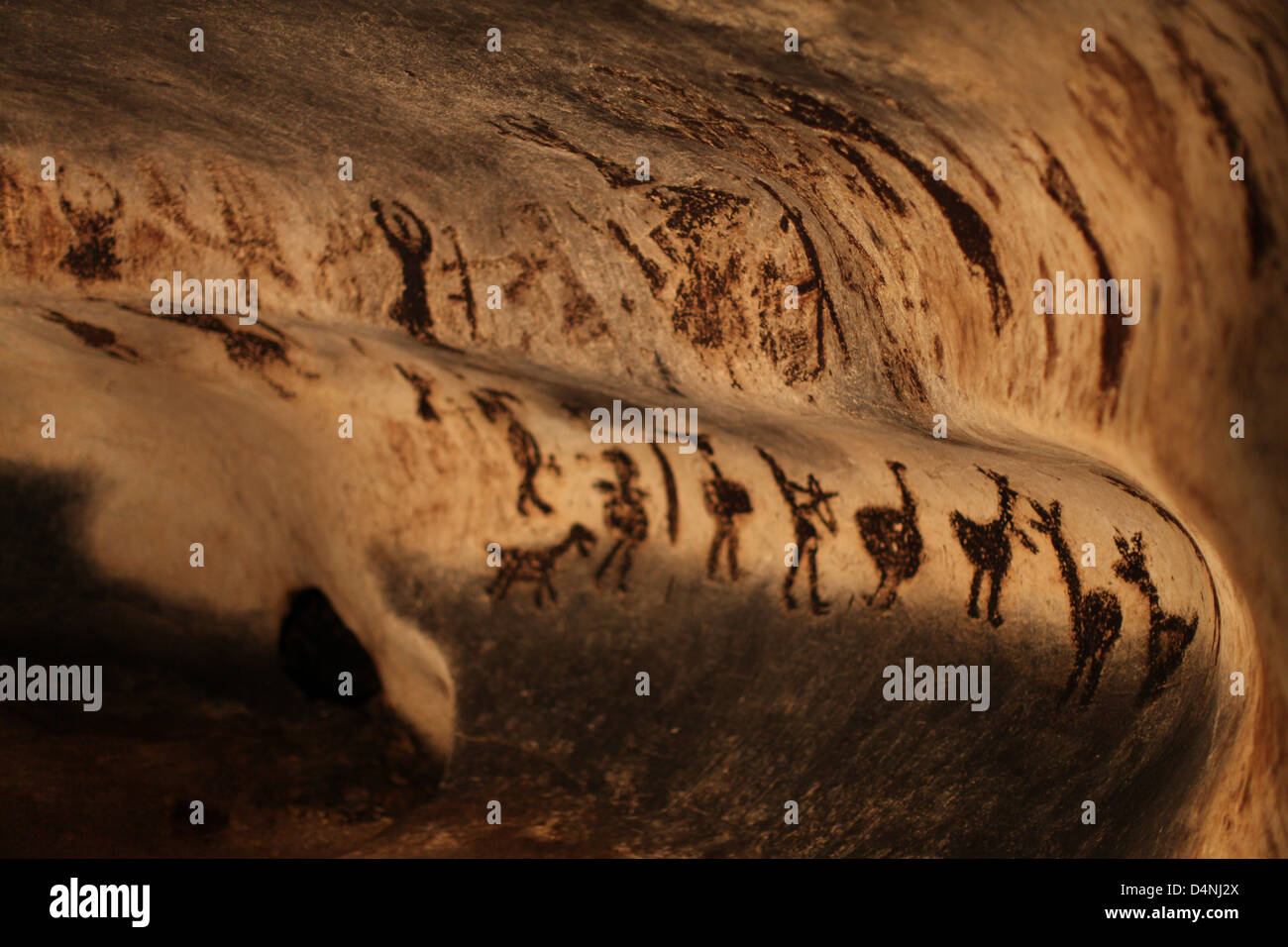 Cave ancient carvings Stock Photo