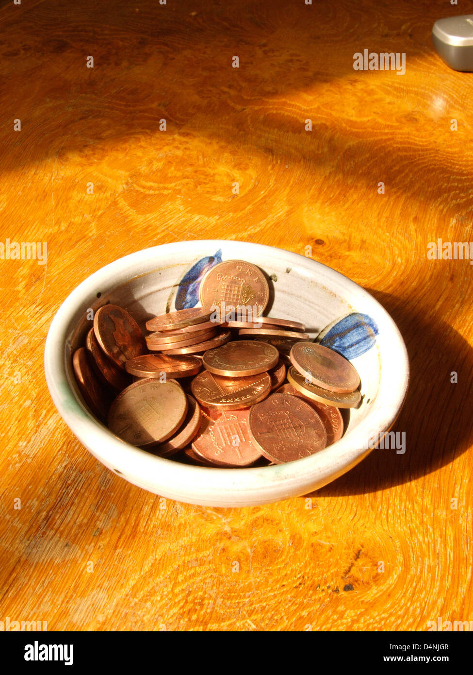 Sunny pot of copper coins Stock Photo Alamy