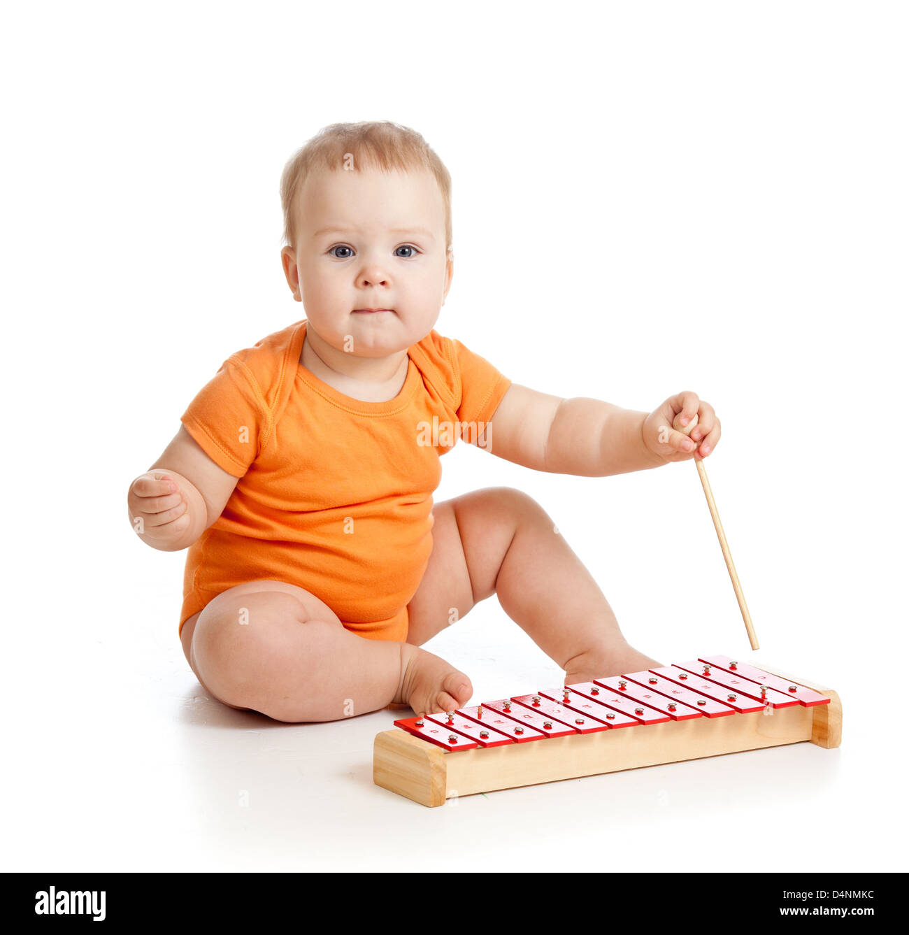 baby playing with musical toy Stock Photo